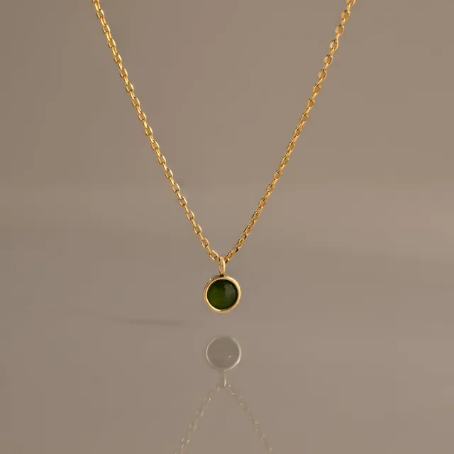 Jade Charm Necklace, a round jade pendant on a gold chain