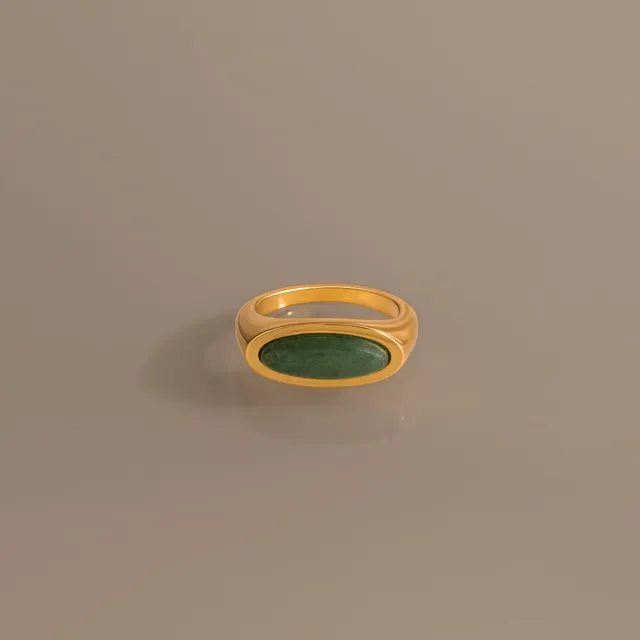 Jade Ellipse Signet Ring, an oval jade stone in a polished gold bezel
