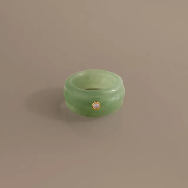 Sculpted Jade and Opal Band, a carved jade band with one opal
