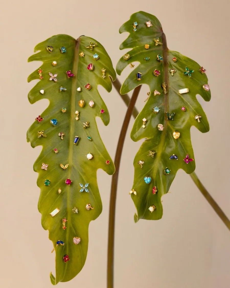 Green leaves pierced with small gemstone studs