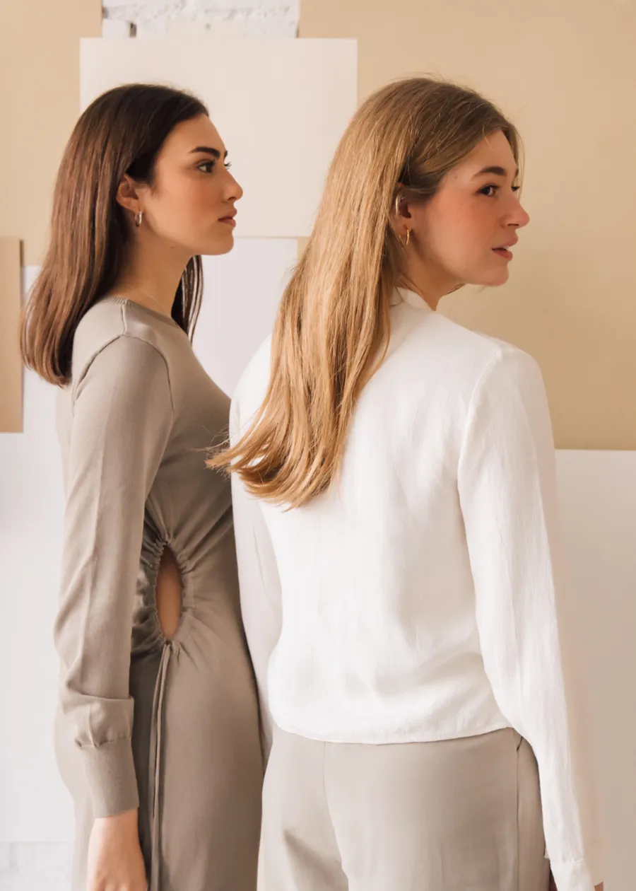 Two members of the Caitlyn Minimalist team standing side by side